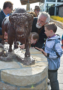 Tom Tischler at the unveiling of his bison sculpture