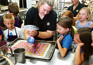 Children at a kid's baking class with Belle Kitchen