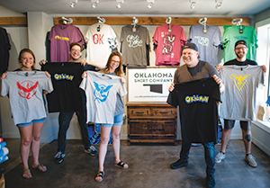 The team at Oklahoma Shirt Company with their Pokemon Go team shirts