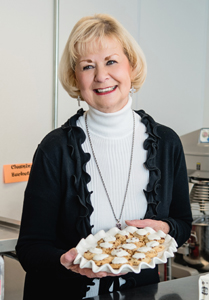 Sheree Lambert of Edmond Mobile Meals holding a plate of cookies