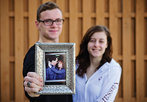 Christian & Candace Osterhout with a picture of their parents